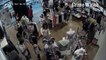 Woman pickpockets iPhone in clothing store. Can you spot it happening first time round?