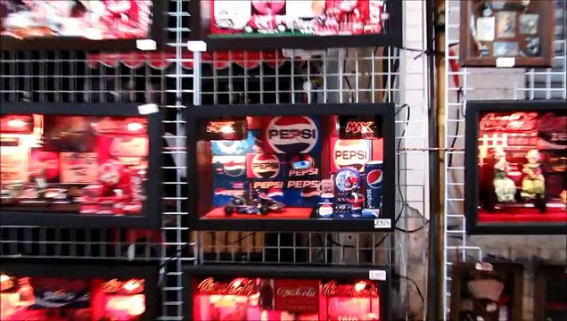 Clocks made from Coca-Cola and Pepsi cans