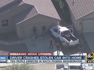 Driver crashes stolen car into Phoenix home