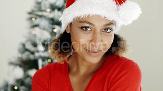 Smiling Woman In a Festive Red Santa Hat | Stock Footage - Videohive