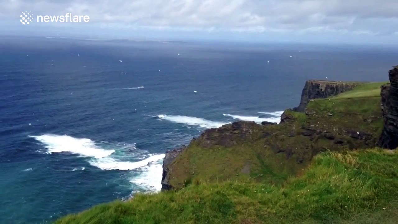 Sea foam flies upwards causing "reverse snow" effect