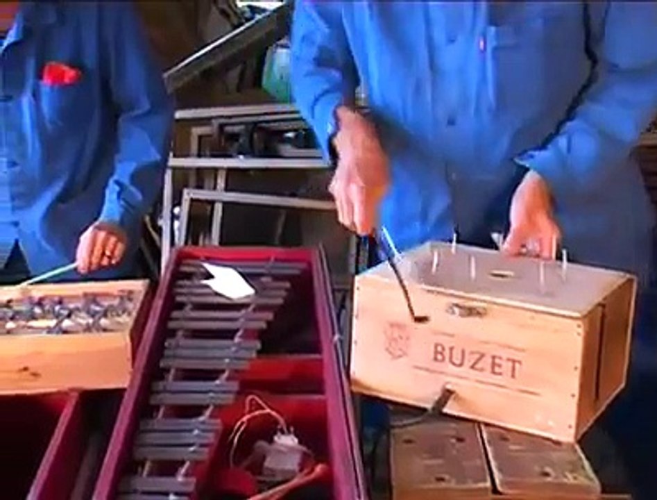 Workers in workshop plays George Bizet opera Carmen