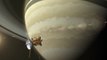 A Frozen Moon Sits Above Saturn's Rings In Stunning Image
