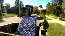 Guy gets mattress into garbage truck only using the claw and he's so happy about it!