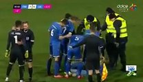 Goalkeeper fighting with a fan during a football game in Romania