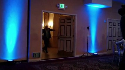 groom kickes his bride while dancing