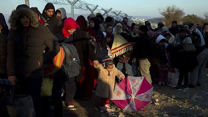 The Latest: Pope lights candle for migrants