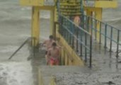 Youths Slammed for Diving Into Choppy Waters Amid Storm Conditions