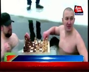 Russian ice swimmers play chess in Cold water