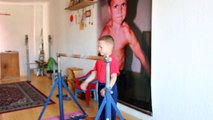 amazing kid doing pushups on the bar