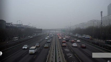 Beijing slashes traffic under pollution red alert