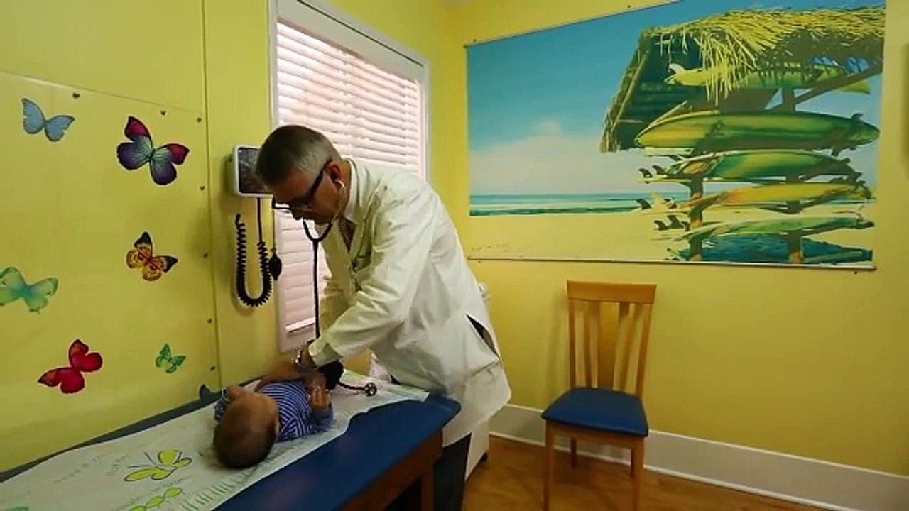 How To Calm A Crying Baby - Dr. Robert Hamilton Demonstrates "The Hold"