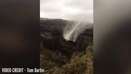 UK weather  Extraordinary footage shows waterfall being forced to flow 'UPWARDS' by extreme