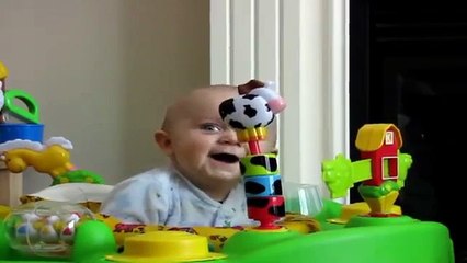 Cute Baby Smiling Over Tearing up The Page