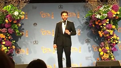 Oscar Isaac backstage after winning a Golden Globe for 'Show Me a Hero'