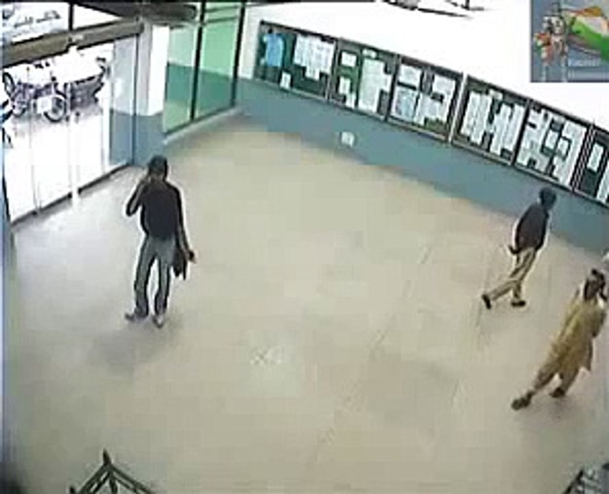 Pakistani goes through glass door