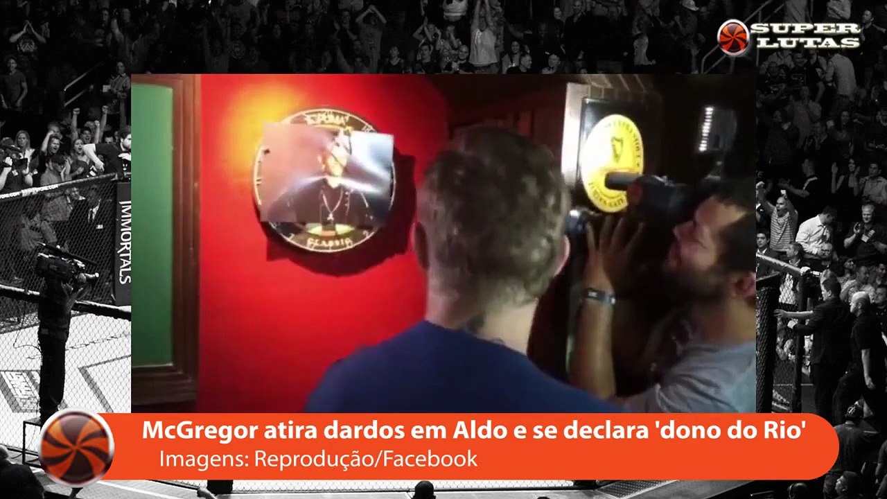 'DONO DO RIO' CONOR McGREGOR JOGA DARDOS EM JOSE ALDO E RASGA FOTO DE CAMPEÃO