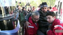 Syria rebels start leaving Homs district under truce deal