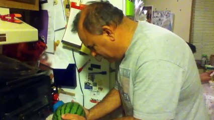 Man Tries to Break Watermelon With His Head