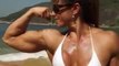 Women Stunning Brazilian female Bodybuilding posing on the beach
