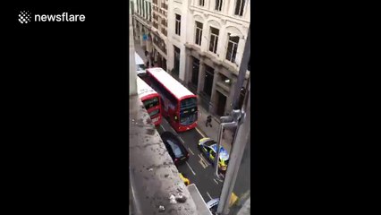 Police swoop on London bus after 'samurai sword' umbrella reports