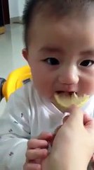 Kid tastes lemon for the first time