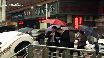 Woman saved after backing SUV into subway