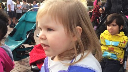 Cute little Girl gets happy when hearing Frozen Song played by Marching Band