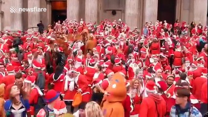 Hundreds of drunken Santas take over London