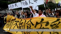 Angry Taiwanese rally against food scandal acquittal