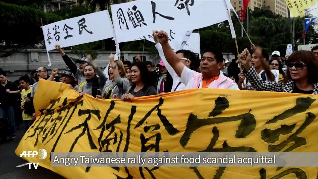 Angry Taiwanese rally against food scandal acquittal