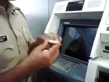Police official showing how ATM fraud happens these days. Be Careful !