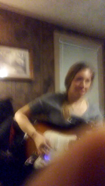 Olivia Bradbury playing on a guitar loud funny