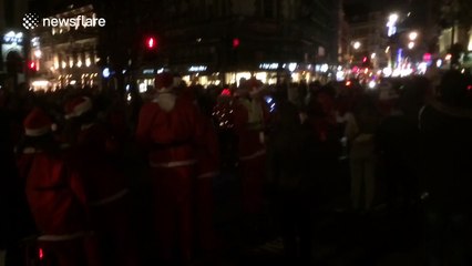 Rollerblading Santas parade through London