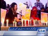 Candles lit in memory of the martyrs of Peshawar attack in liberty round about