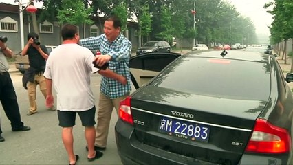 Chinese police push protesters outside courtroom