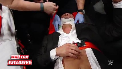 Triple H helped by paramedics after being attacked by Roman Reigns- WWE.com Exclusive, Dec. 13, 2015