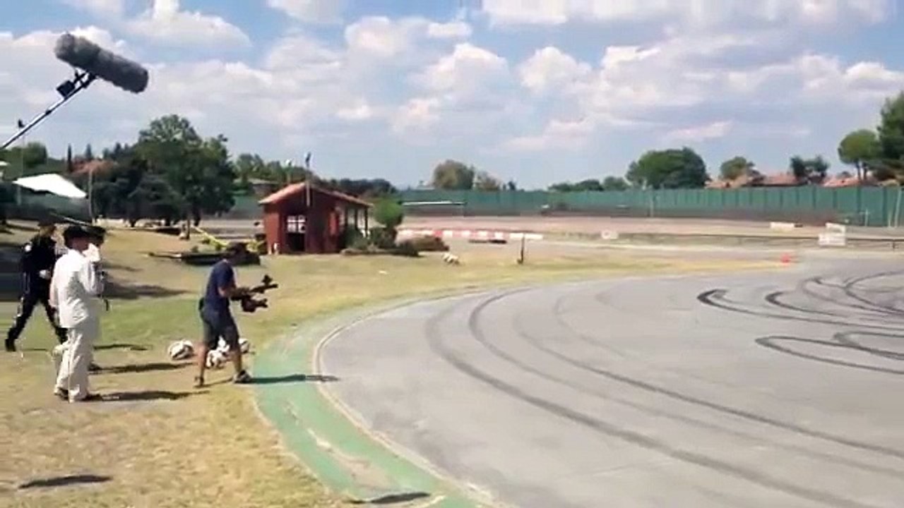 Cristiano Ronaldo shooting balls on the track with Jenson Button