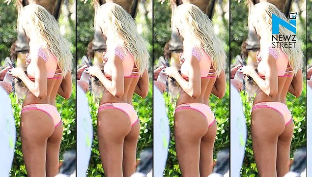Candice Swanepoel dons cheeky off-the-shoulder pink bikini and play on beach