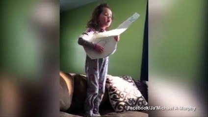 Sincere little girl covers Adele strumming cardboard guitar