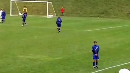 Boy in the way of Another Boy's Soccer Trick