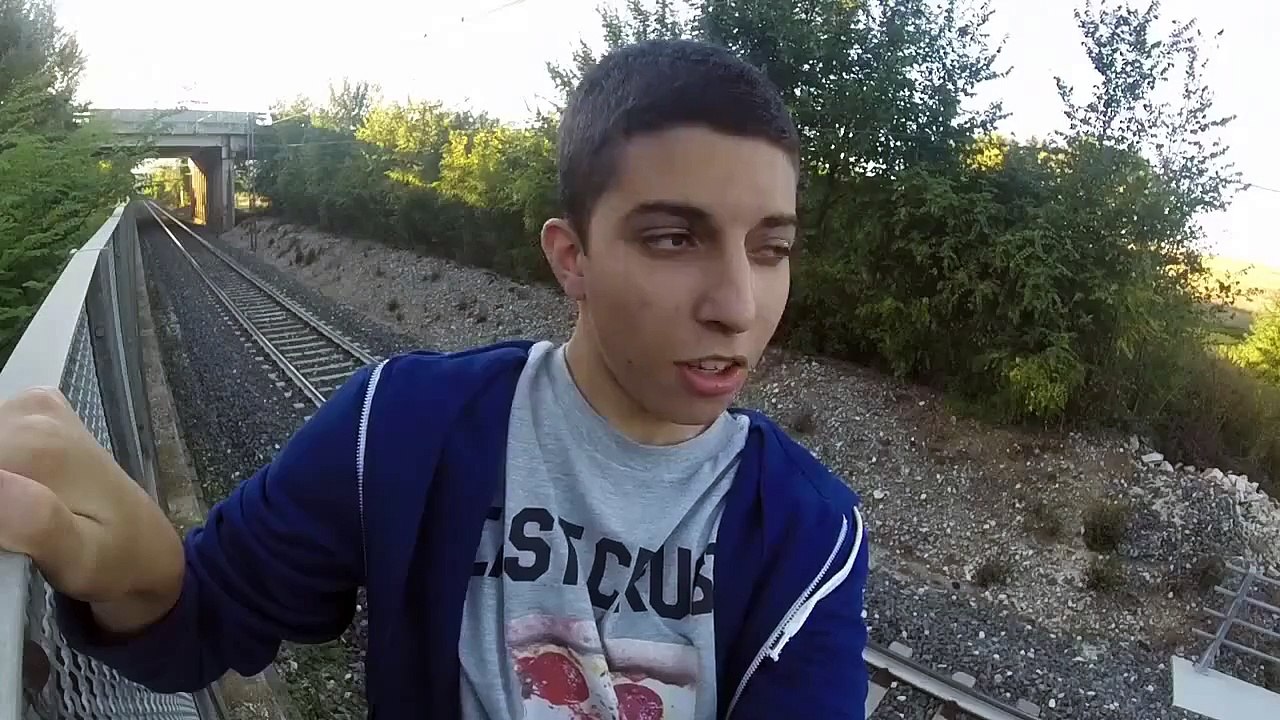 TRAIN PASSING OVER A CRAZY GUY!