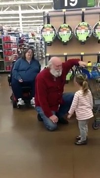 little girl mistaking a man for Santa Claus