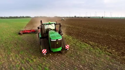 The new John Deere 9RX series tractor at work (day time)