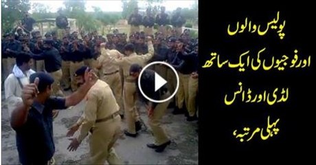 Police and army men dancing together for the first time.