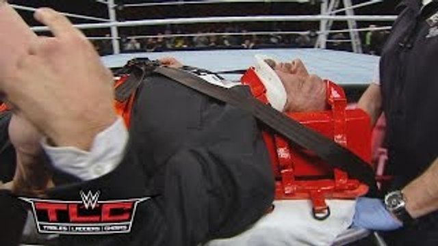 Triple H helped by paramedics after being attacked by Roman Reigns: WWE.com Exclusive, Dec