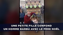 Une petite fille confond le client d'un supermarché avec le père Noël