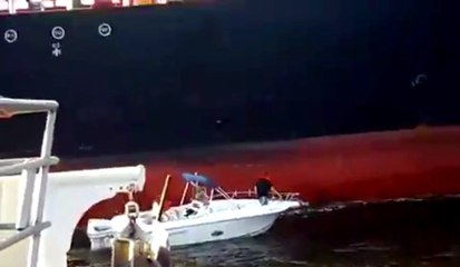 Small Boat Nearly Crushed By Massive Tanker Ship