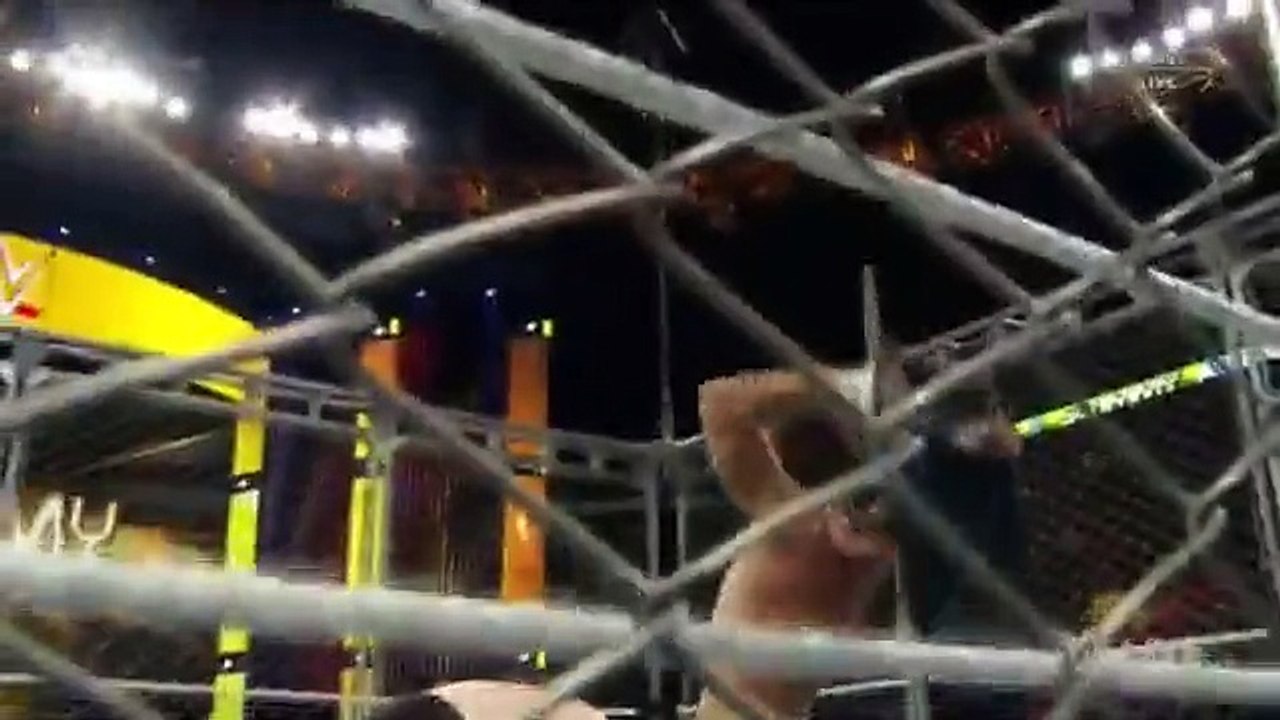 Roman Reigns throw steel chair inside steel cage to help Dean Ambrose WWE Raw 21-12-2015