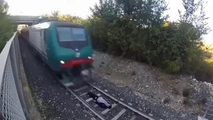 OMG!!! Crazy Boy lying under the running Train